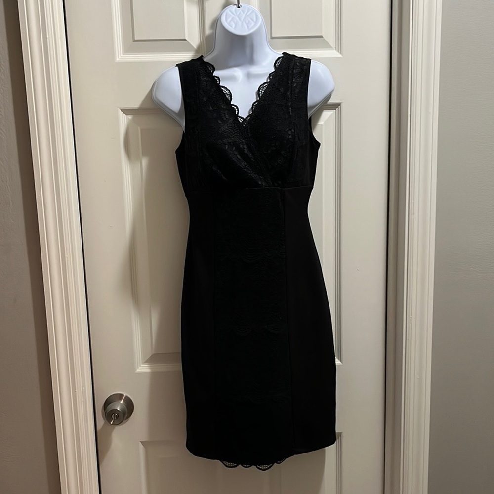 Daisy Fuentes slimming body conscious black dress. NWT. Size 2-4. Gorgeous!